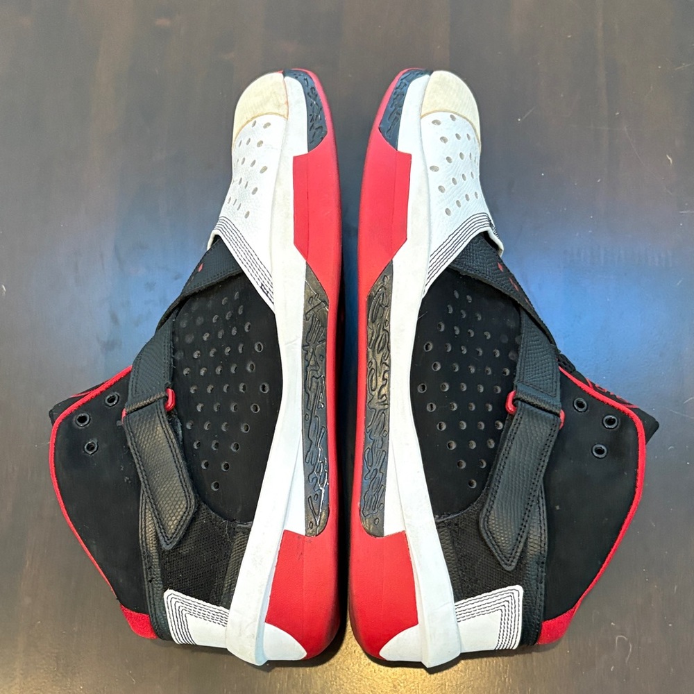 Black and Red High-Top athletic Jordan’s size 13.5